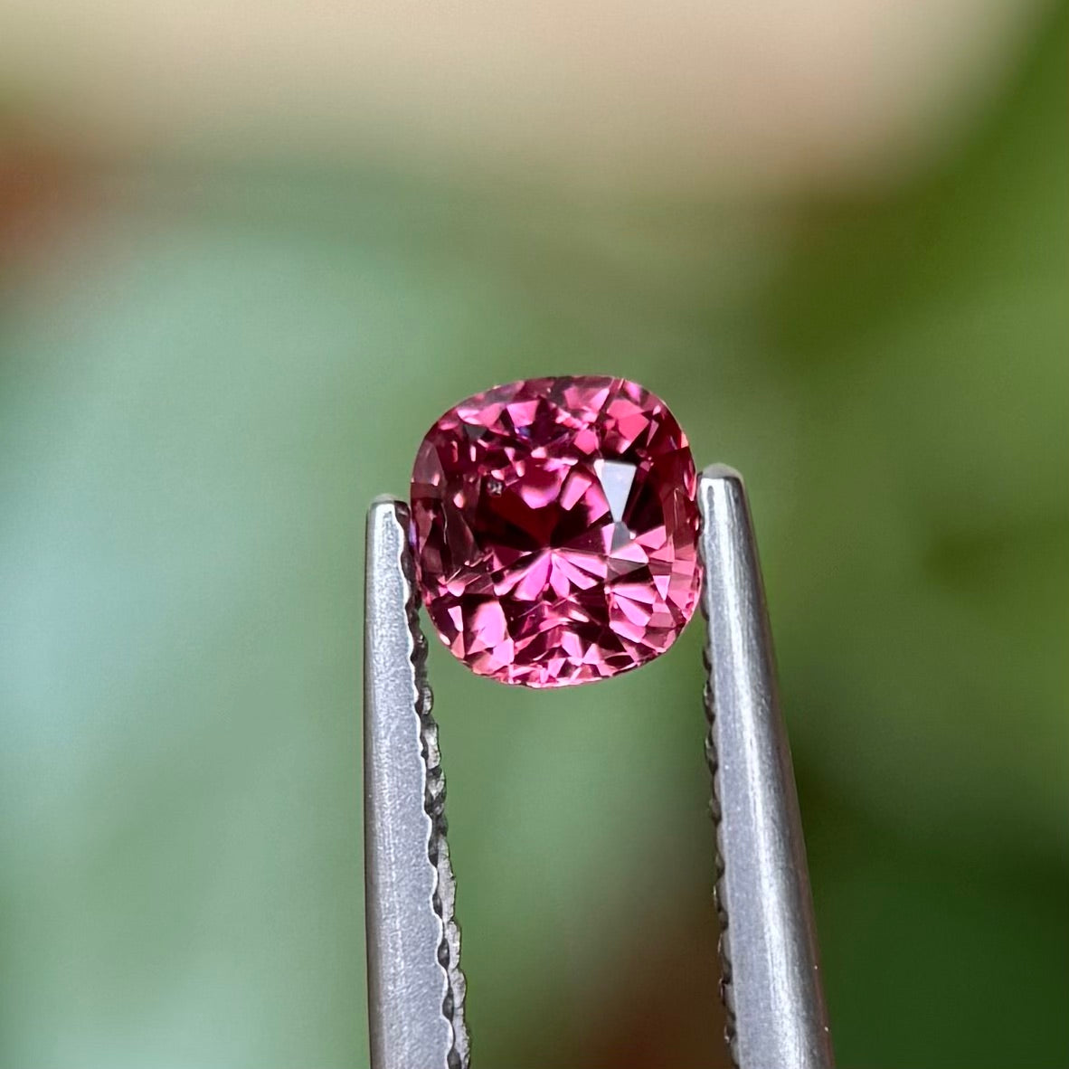 0.73ct Natural Pink-Orange Spinel Vietnam. Cushion Shape.