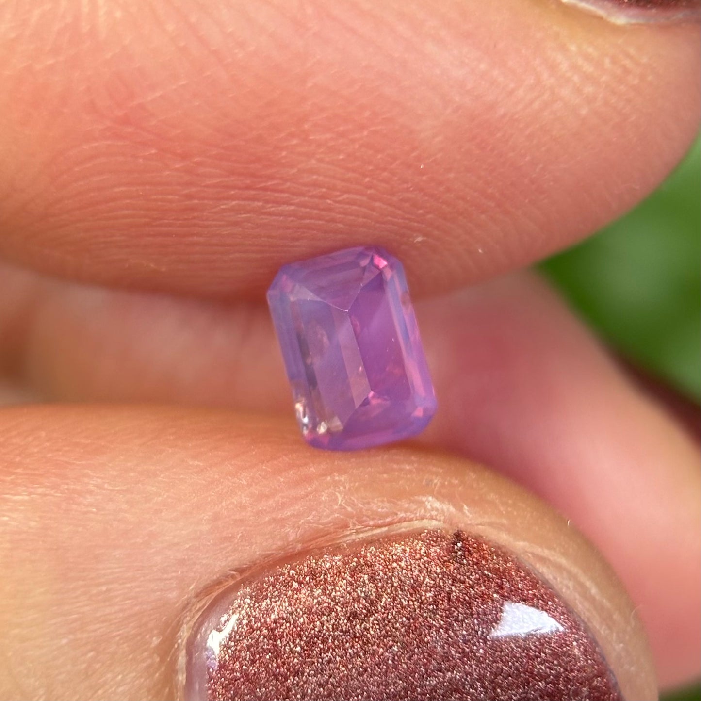 0.55 ct Natural Pinkish Purple Milky Sapphire Vietnam. Emerald Shape. No Treatment.