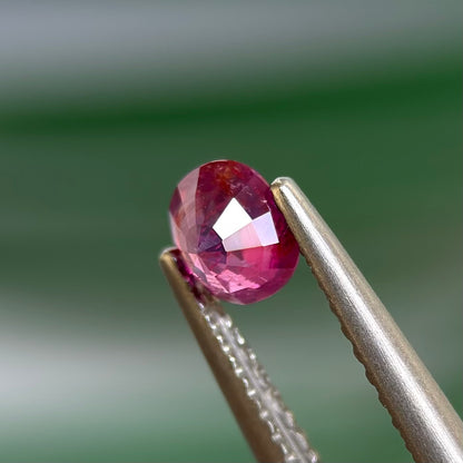 0.59 ct Natural Prurplish Pink Sapphire Vietnam. Cushion Shape. No Treatment.