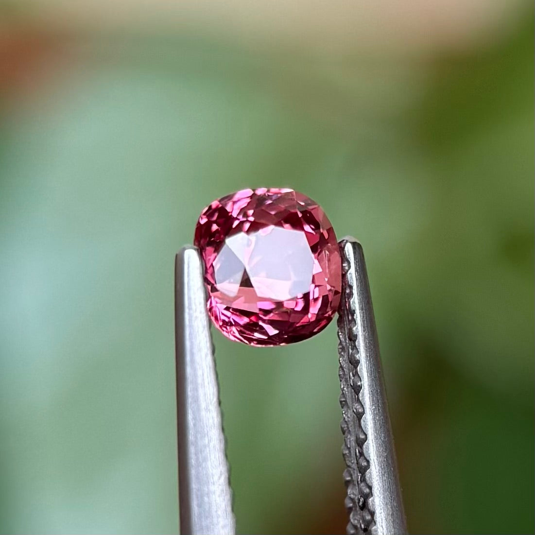 0.73ct Natural Pink-Orange Spinel Vietnam. Cushion Shape.